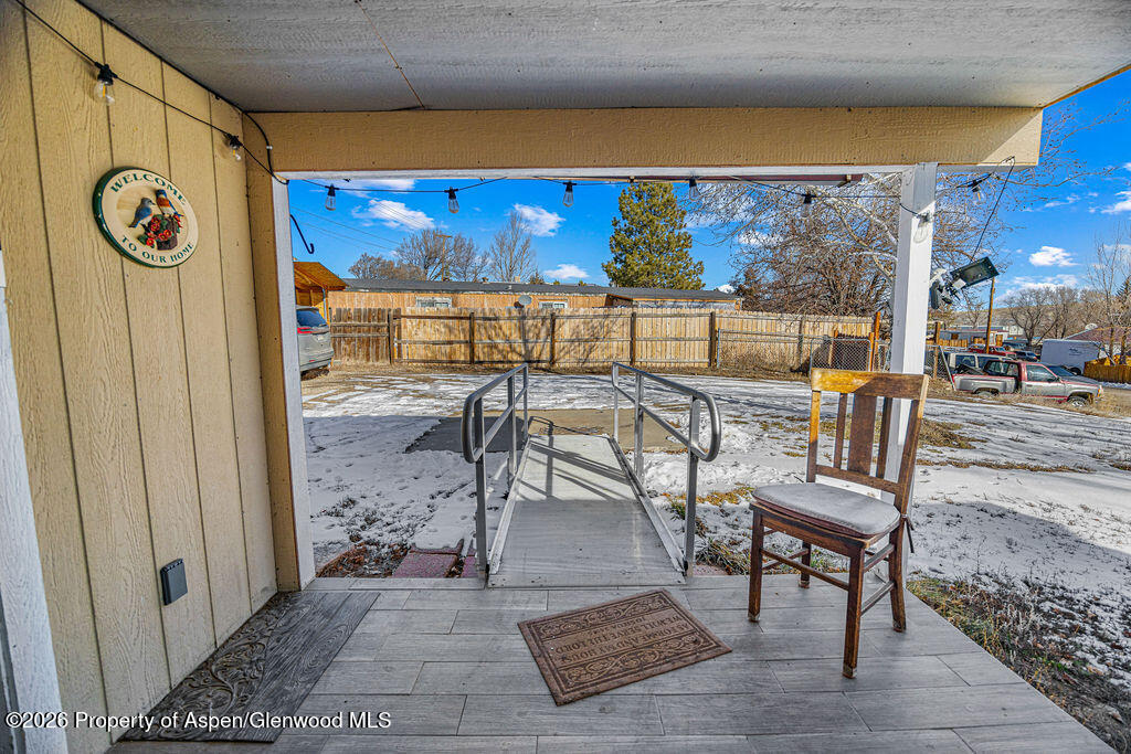1464 Sage Street Craig, CO 81625 - Photo 30 of 47 a view of a patio with a table and chairs