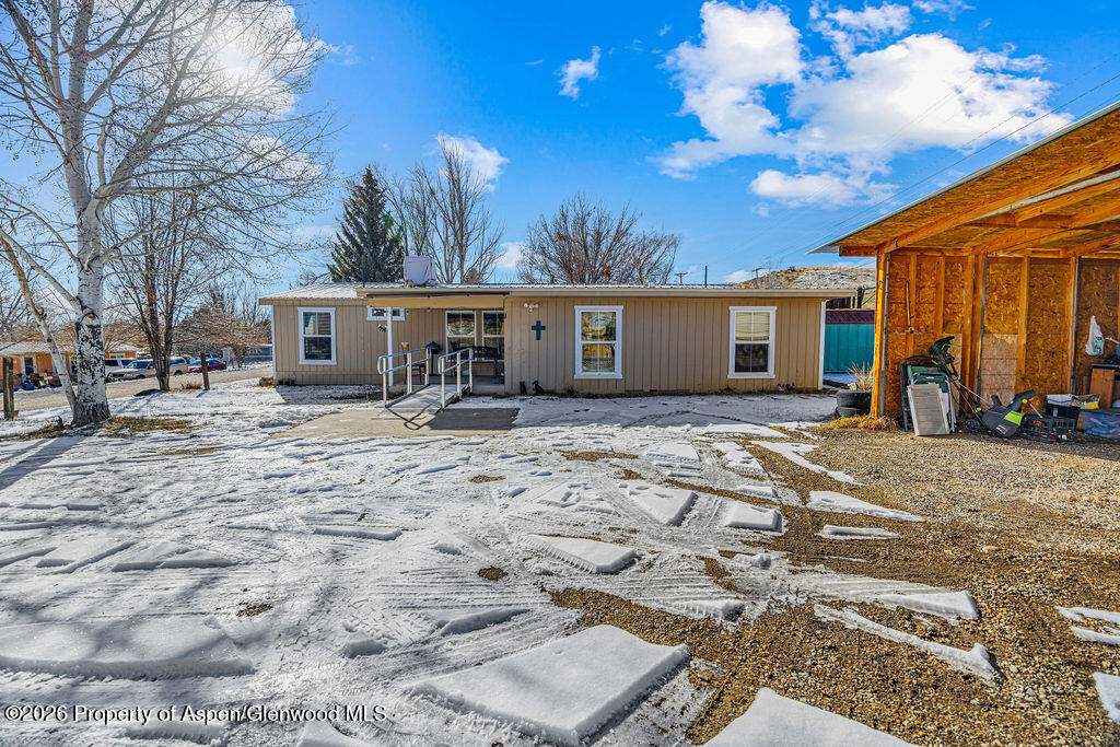 1464 Sage Street Craig, CO 81625 - Photo 31 of 47 a view of a house with a patio