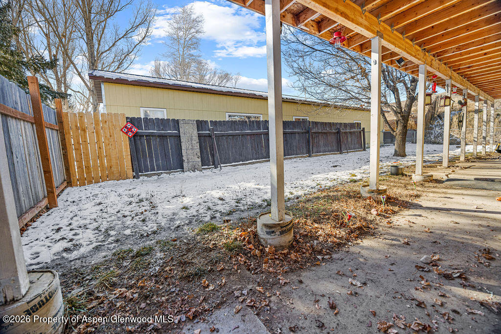 1464 Sage Street Craig, CO 81625 - Photo 34 of 47 a view of a backyard with a large tree