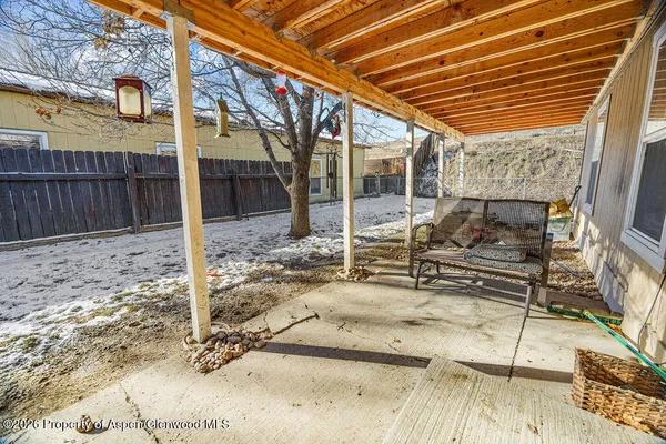 a patio with table and chairs