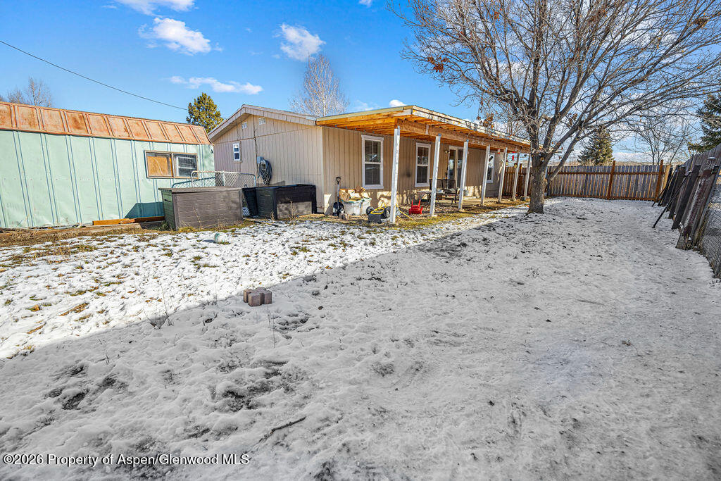 1464 Sage Street Craig, CO 81625 - Photo 38 of 47 a front view of a house with a yard