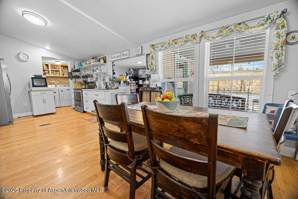 1464 Sage Street Craig, CO 81625 - Photo 9 of 47 a dining room with furniture and a floor to ceiling window