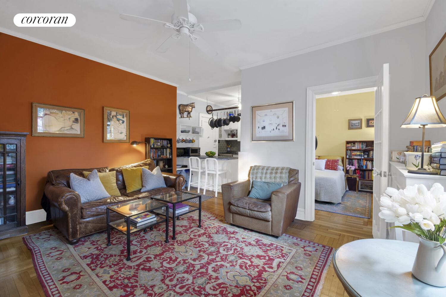 116 Pinehurst Avenue, Unit D1 Manhattan, NY 10033 - Photo 2 of 17 a living room with furniture and a rug