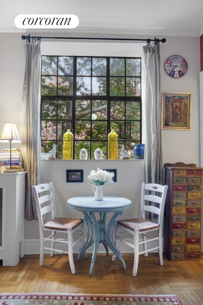 116 Pinehurst Avenue, Unit D1 Manhattan, NY 10033 - Photo 5 of 17 a dining room with furniture and a floor to ceiling window