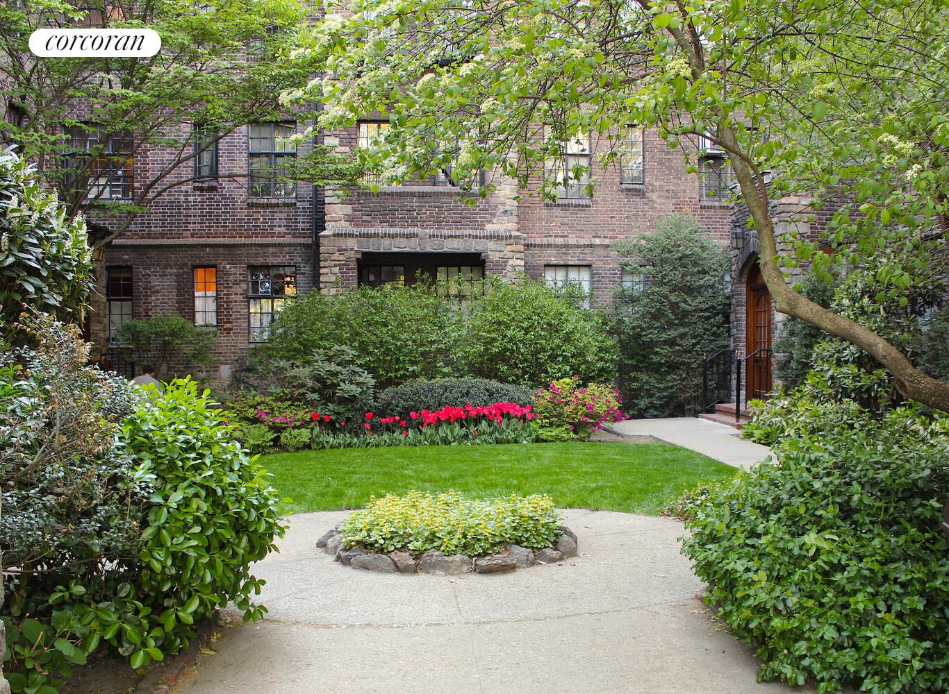 116 Pinehurst Avenue, Unit D1 Manhattan, NY 10033 - Photo 8 of 17 a front view of a house with a garden