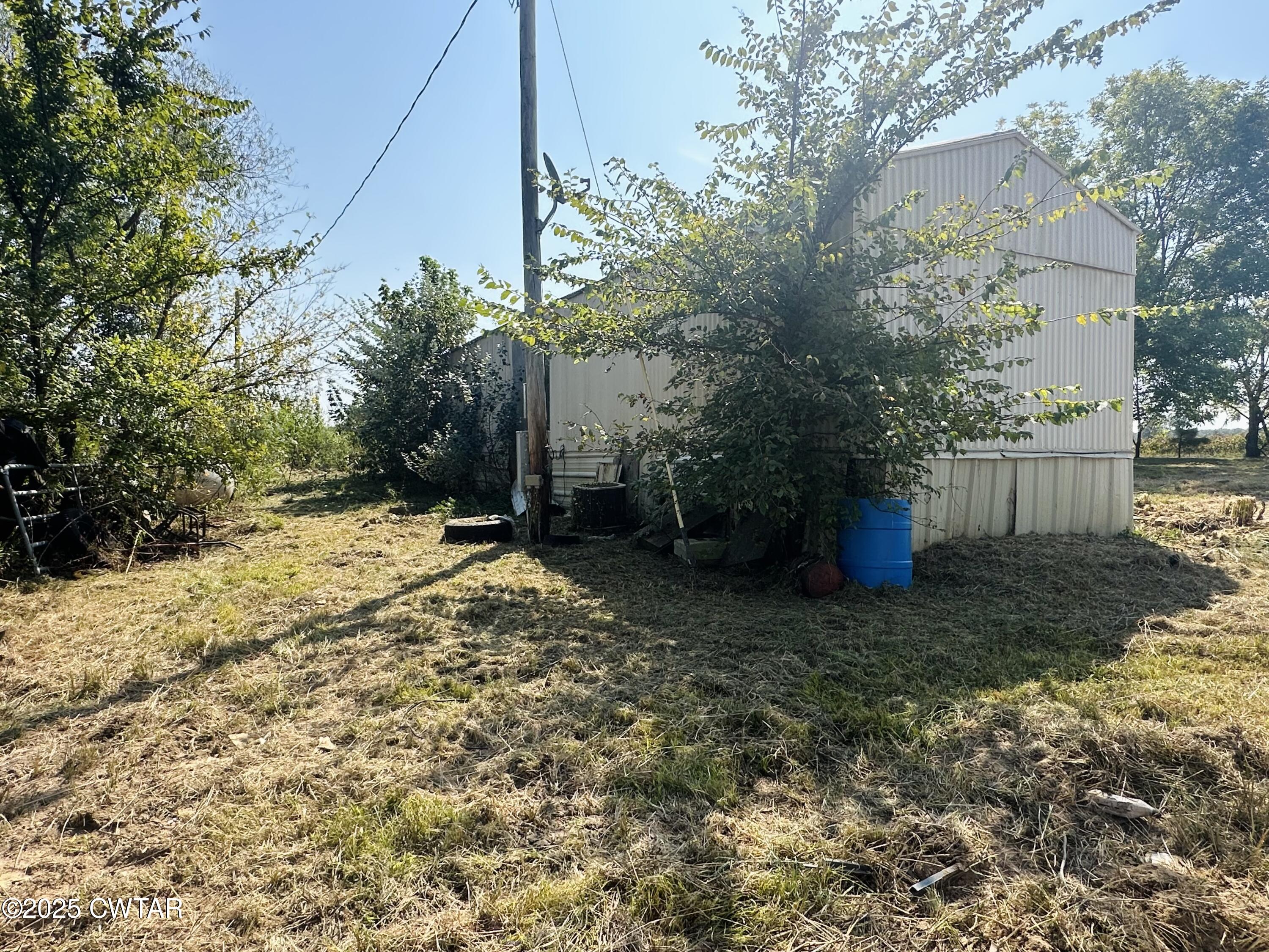 1144 Pumping Station Road Stanton, TN 38069 - Photo 6 of 10 a view of a yard with plants and trees