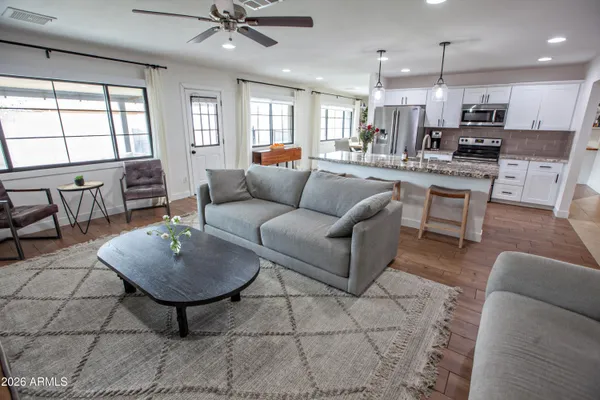 a white toilet sitting next to a shower curtain