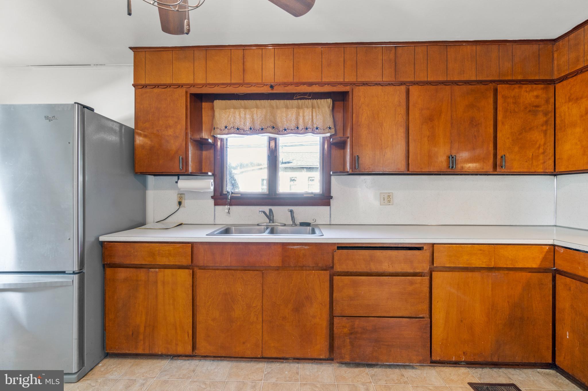 262 Laurel Street Carneys Point, NJ 08069 - Photo 7 of 12 a kitchen with a sink and cabinets