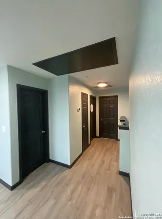 an empty room with wooden floor