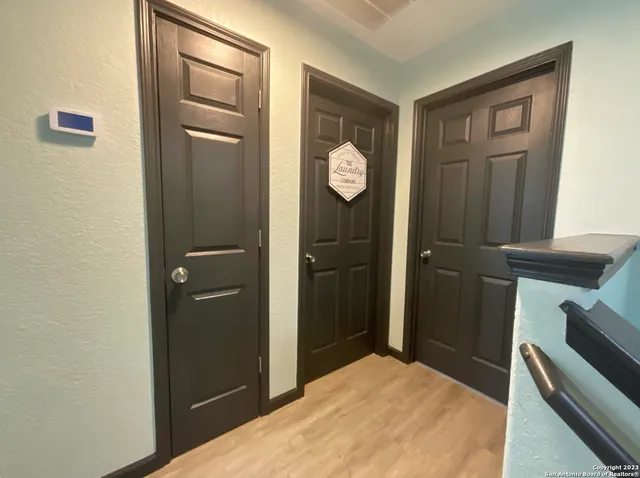 a bedroom with a bed and a mirror