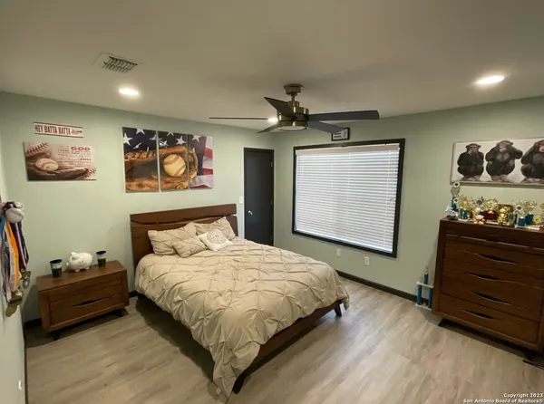 a bedroom with a bed and dresser