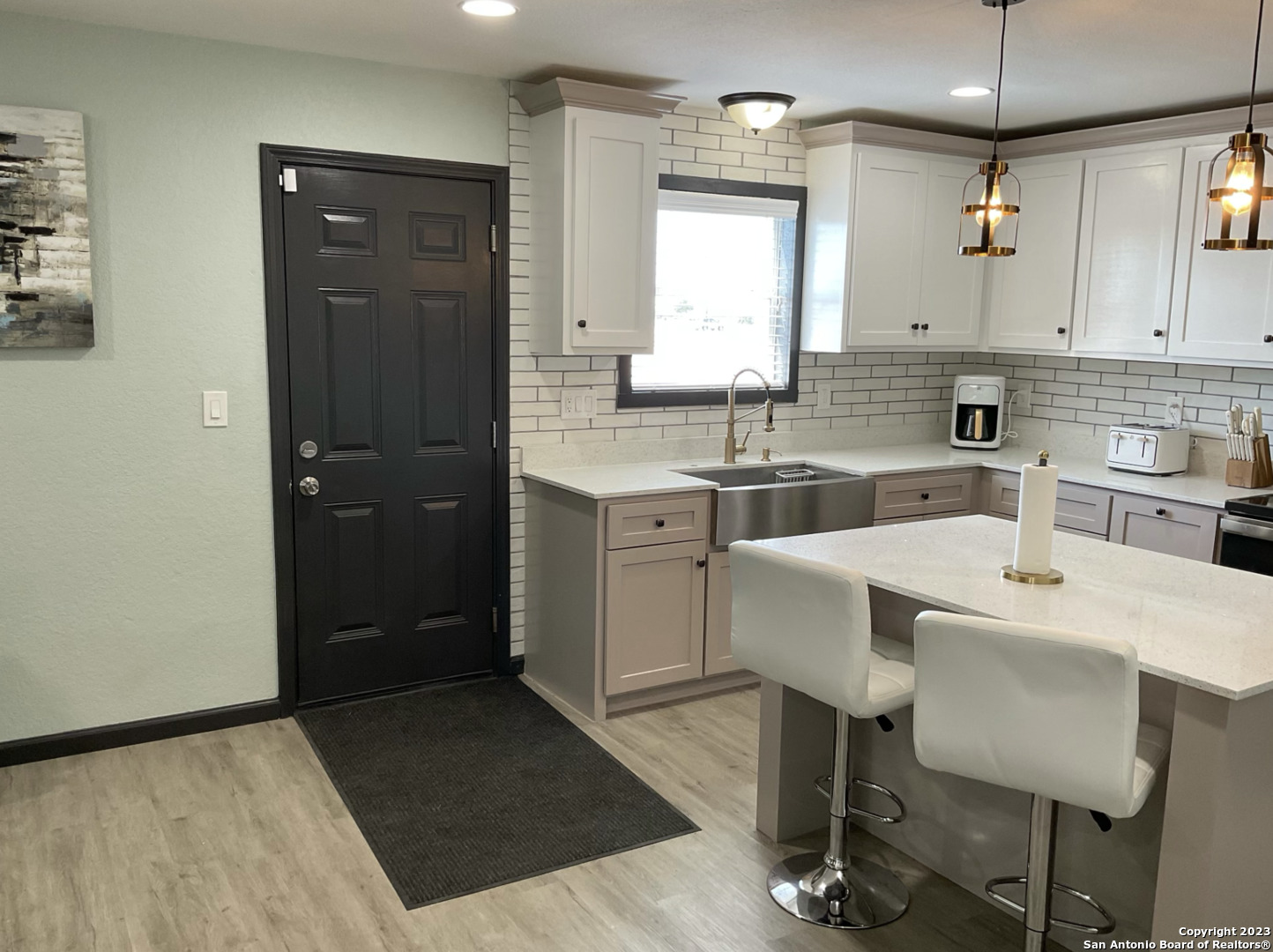 6650 Hartnet Fields Converse, TX 78109 - Photo 21 of 29 a kitchen with a sink cabinets and wooden floor