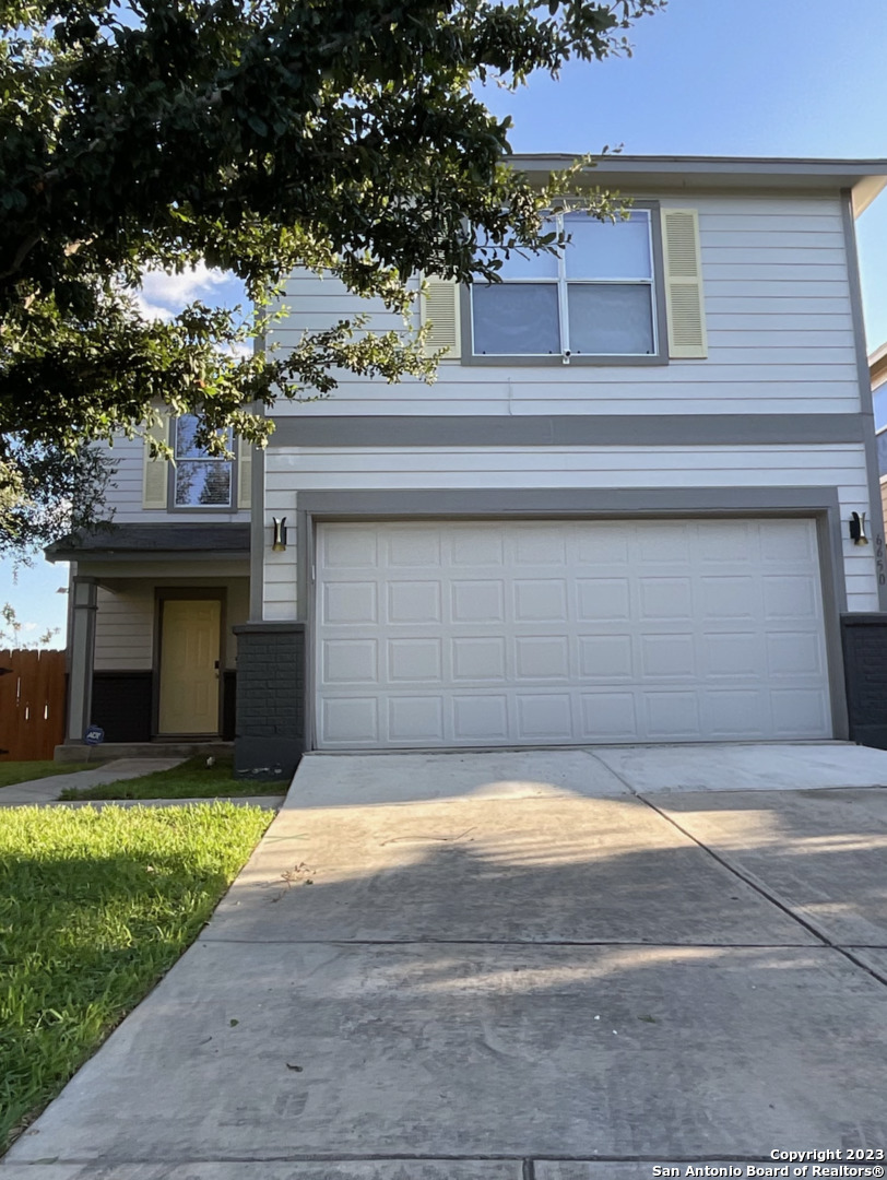 6650 Hartnet Fields Converse, TX 78109 - Photo 3 of 29 a view of a house with a yard and a large tree
