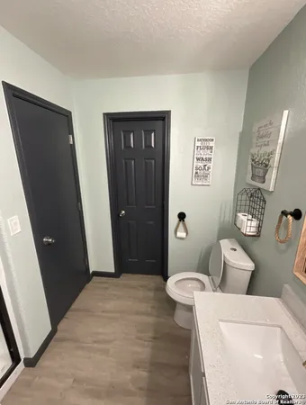 a bathroom with a toilet and a sink