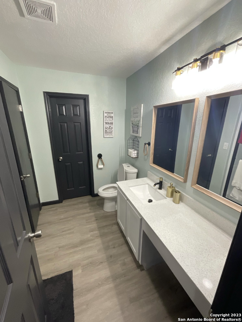 6650 Hartnet Fields Converse, TX 78109 - Photo 7 of 29 a room with a bed and a flat screen tv