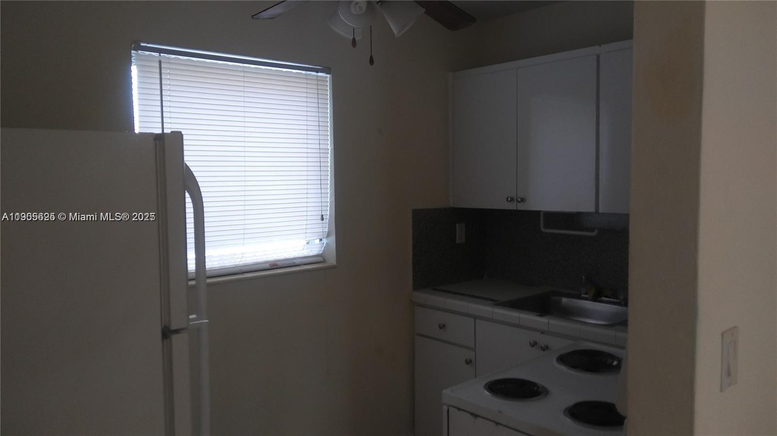 2441 Southwest 27th Avenue, Unit 3 Miami, FL 33145 - Photo 2 of 4 a view of a storage & utility room in a room