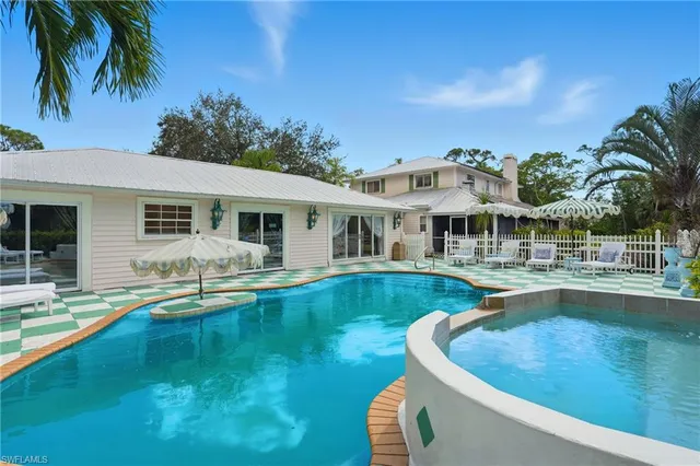 a view of a house with swimming pool