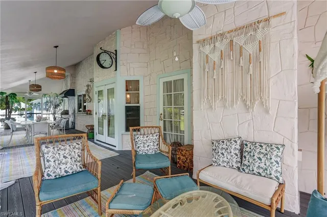 a view of a house with sitting area and wooden floor