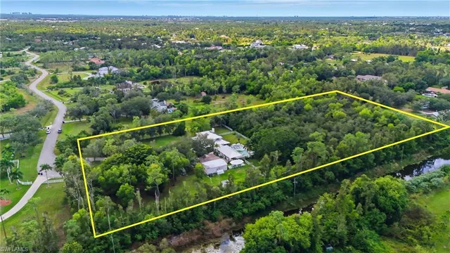a swimming pool with outdoor seating and yard