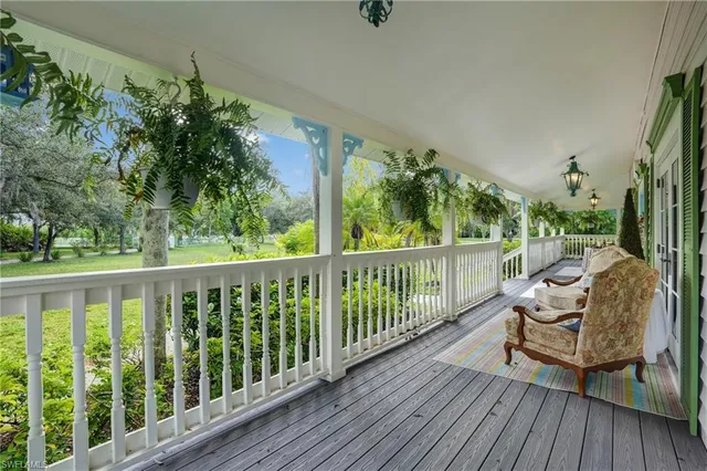 a view of a two chairs in the balcony
