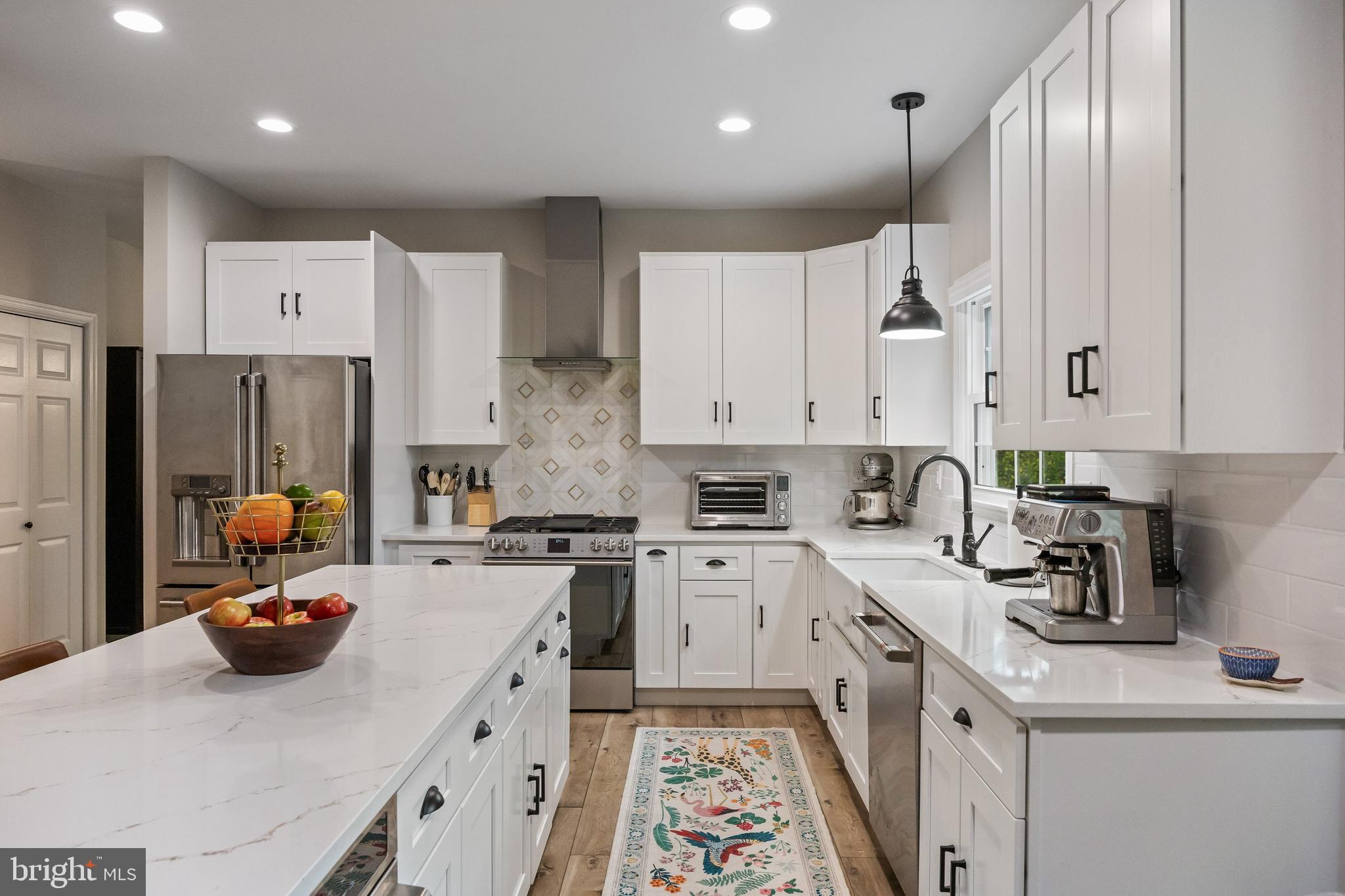 316 West 3rd Street Moorestown, NJ 08057 - Photo 11 of 48 a kitchen with stainless steel appliances a stove a sink a refrigerator and cabinets