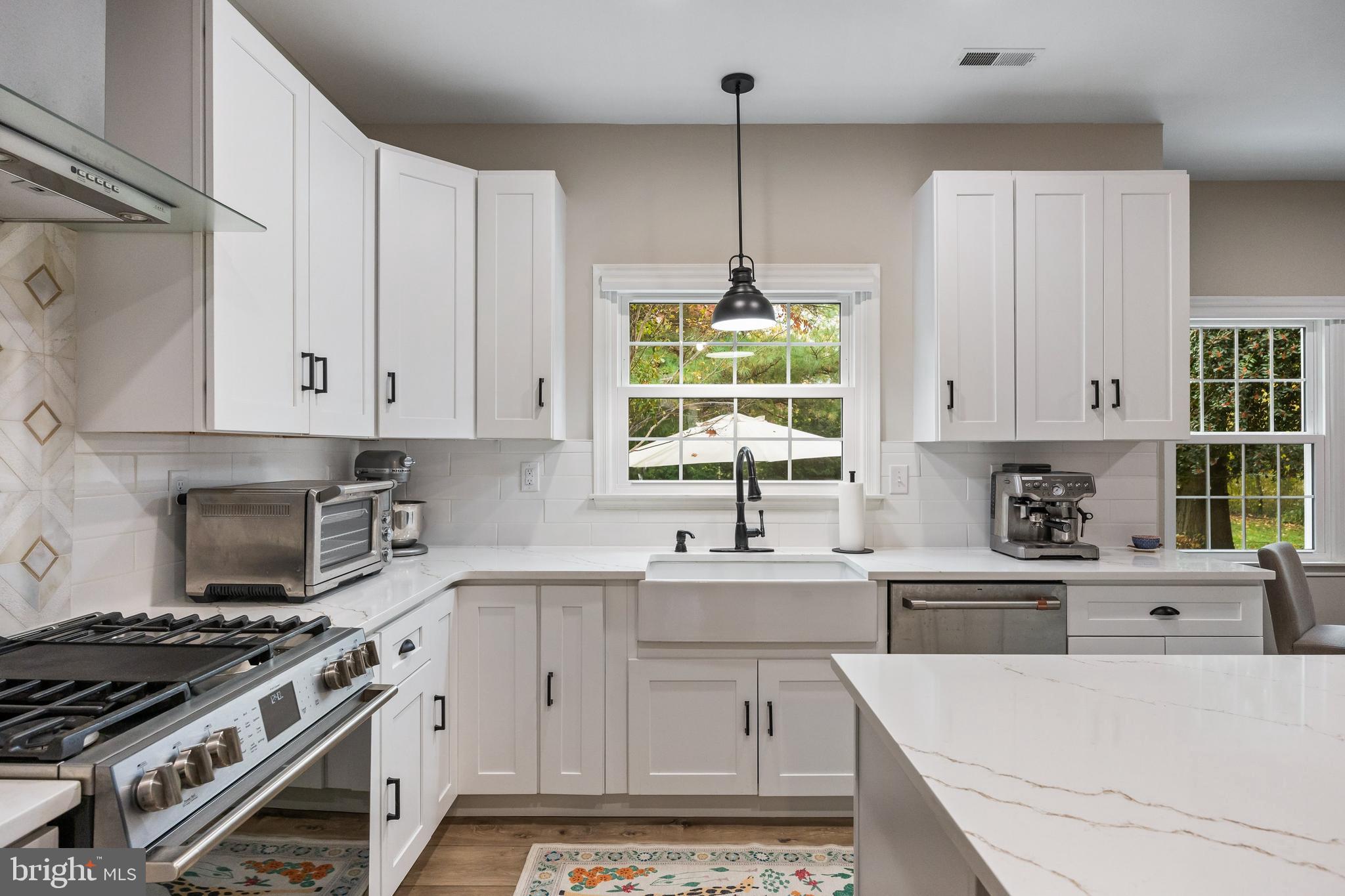 316 West 3rd Street Moorestown, NJ 08057 - Photo 13 of 48 a kitchen with stainless steel appliances a stove a sink a window and cabinets