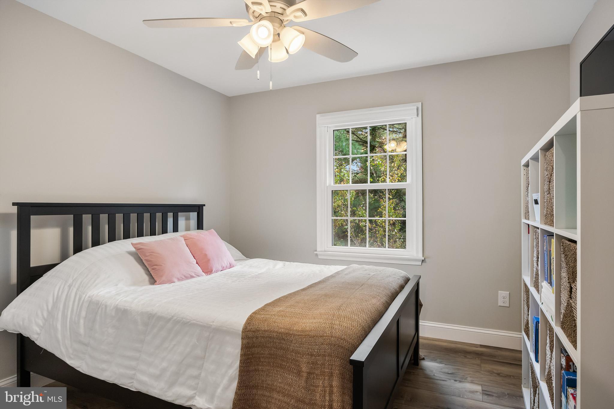 316 West 3rd Street Moorestown, NJ 08057 - Photo 31 of 48 a bedroom with a large bed and a chandelier