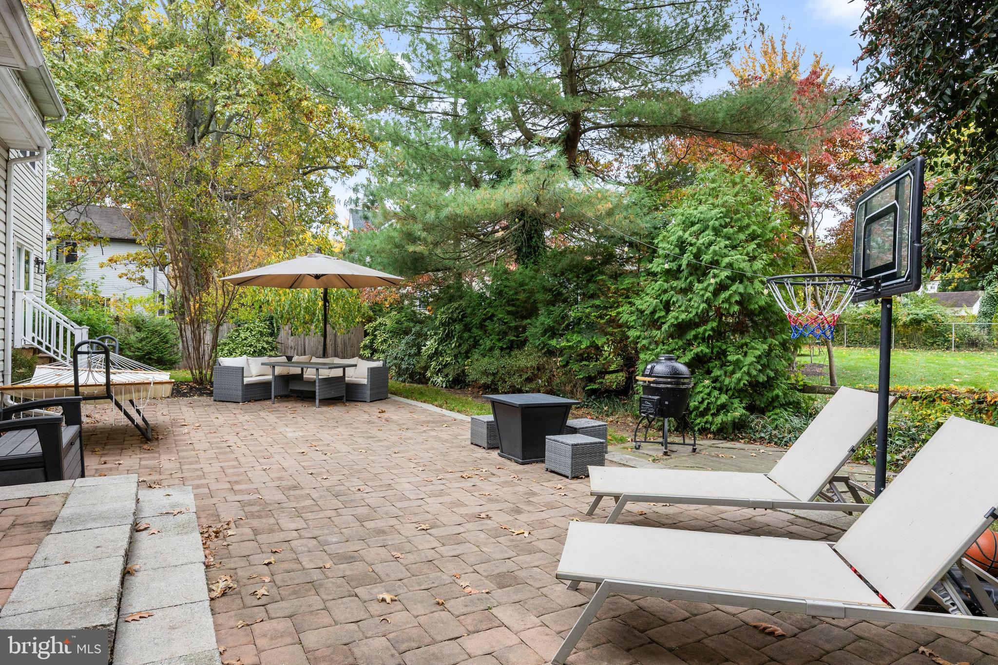 316 West 3rd Street Moorestown, NJ 08057 - Photo 36 of 48 a view of a patio with a table and chairs under an umbrella