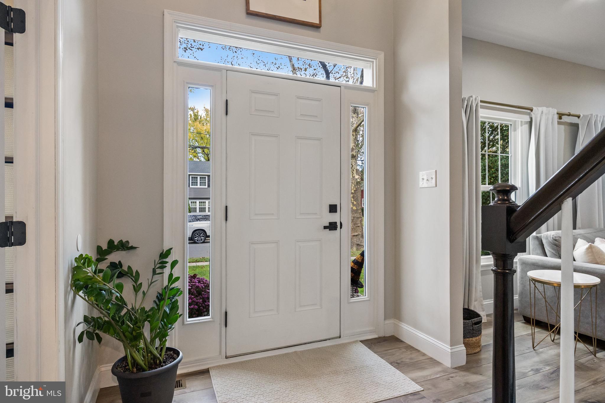 316 West 3rd Street Moorestown, NJ 08057 - Photo 4 of 48 a view of a hallway with wooden floor and a dining room