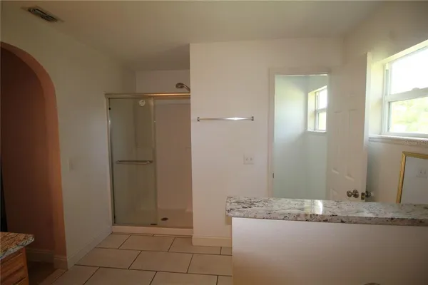 a view of room that has a bed and a cabinets