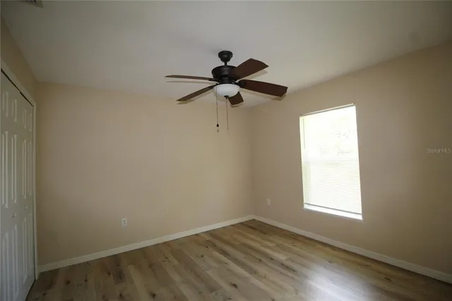 a bathroom with a granite countertop shower and a toilet