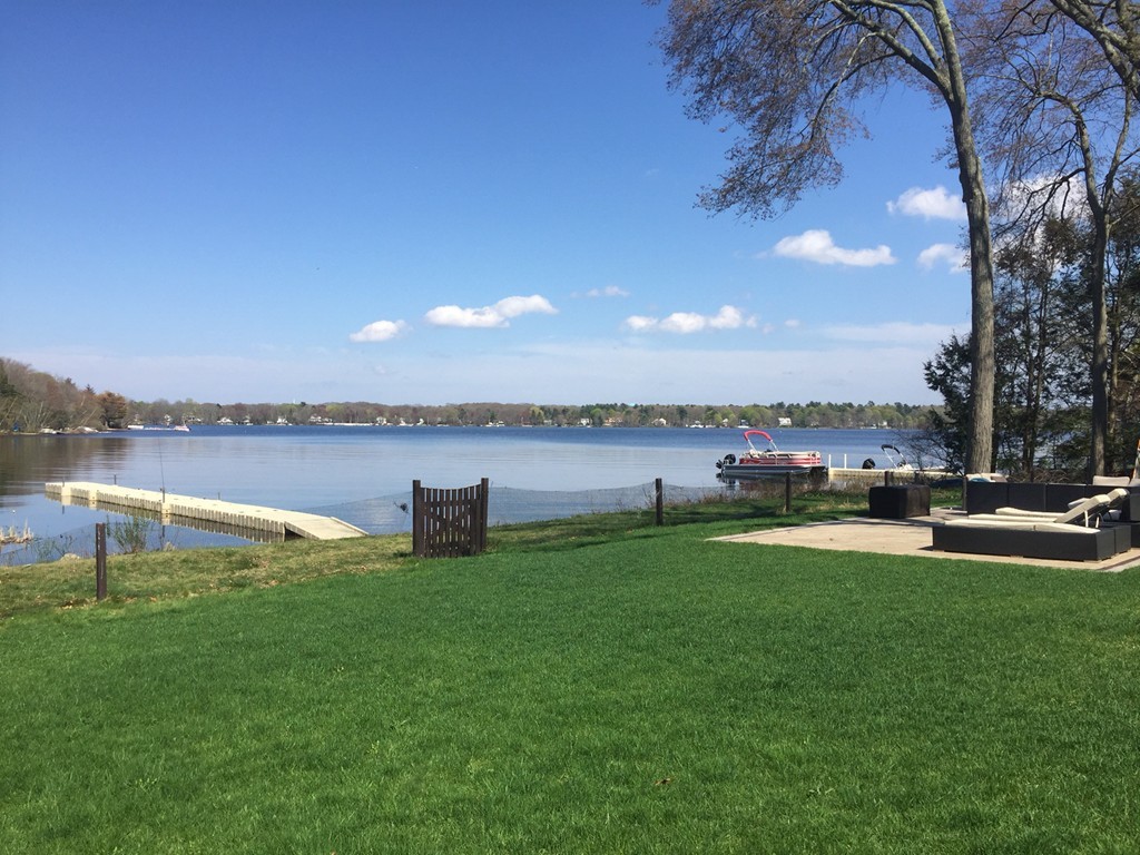 164 Beach Street Sharon, MA 02067 - Photo 1 of 30 a view of a lake with houses
