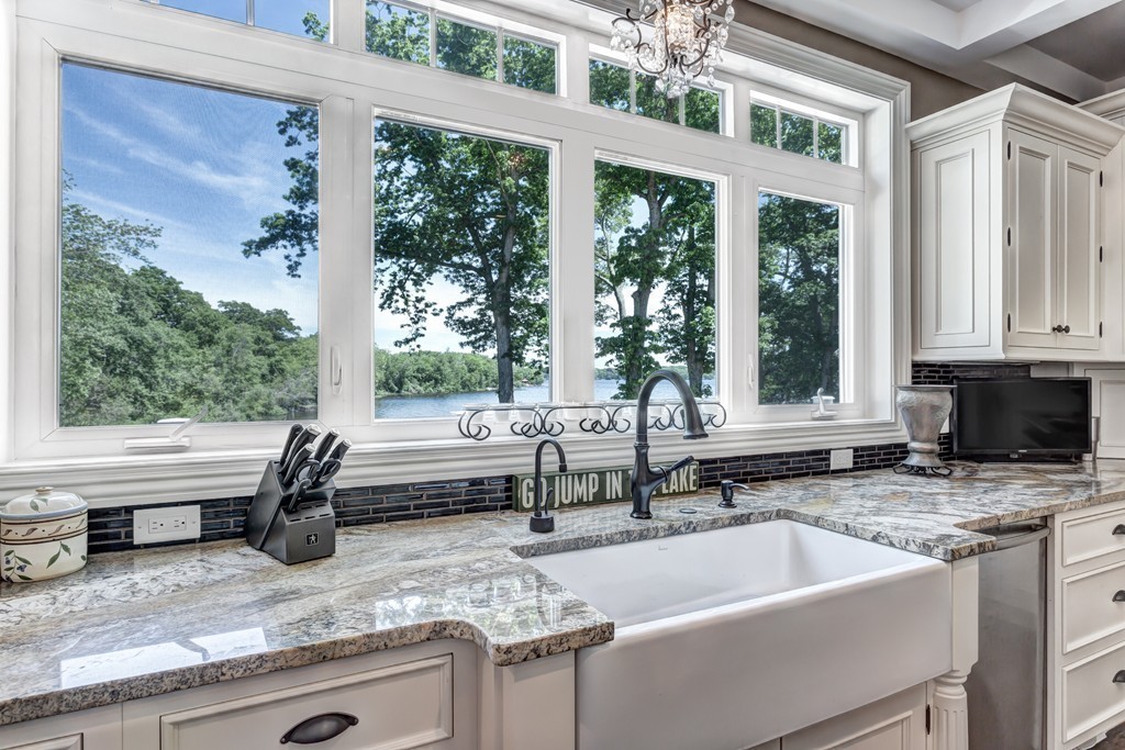 164 Beach Street Sharon, MA 02067 - Photo 11 of 30 a kitchen with a sink and a large window
