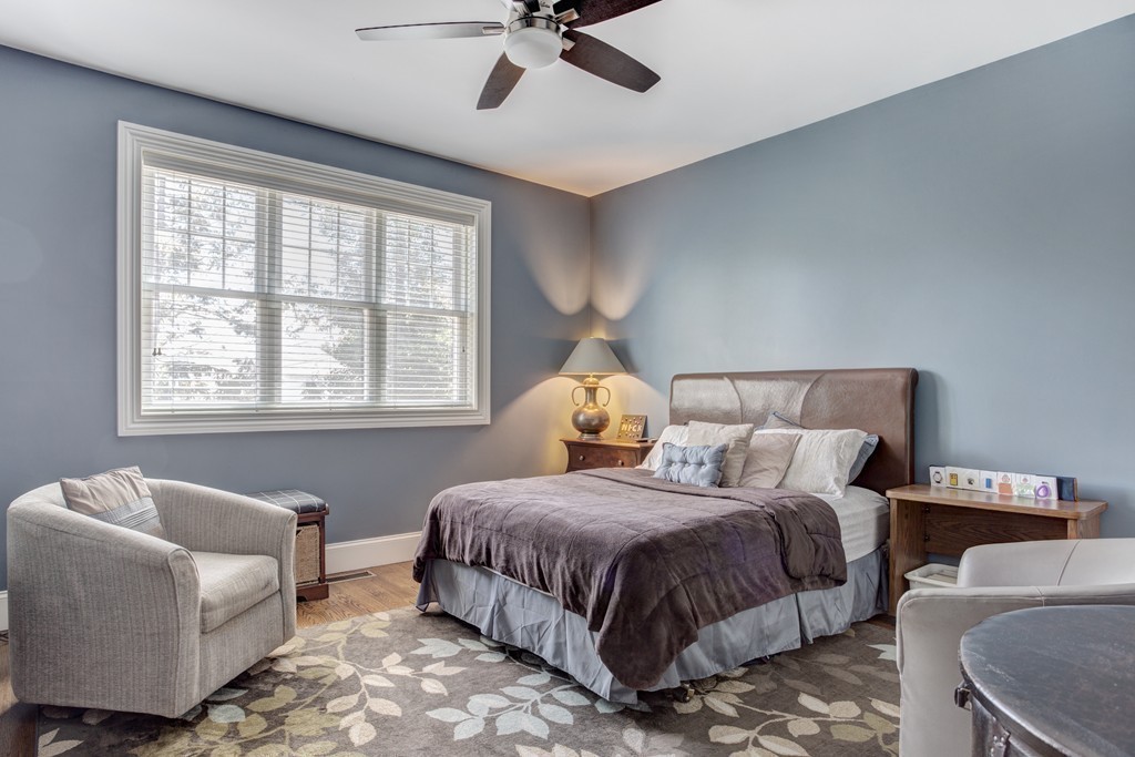 164 Beach Street Sharon, MA 02067 - Photo 15 of 30 a bedroom with bed couch and window
