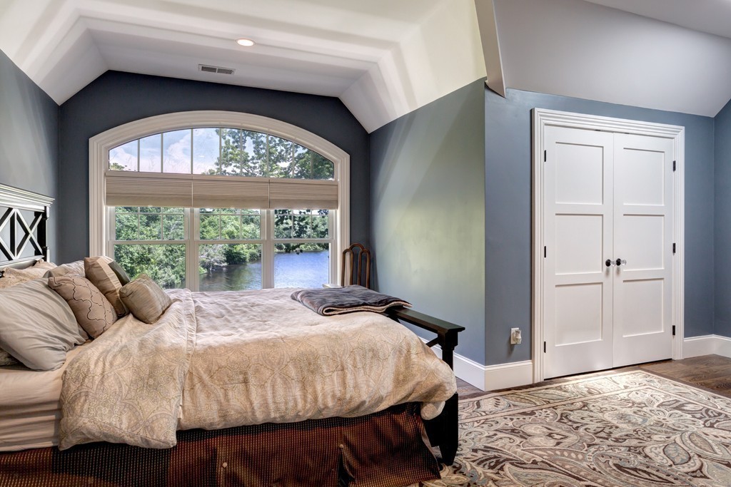 164 Beach Street Sharon, MA 02067 - Photo 20 of 30 a spacious bedroom with a bed and a large window