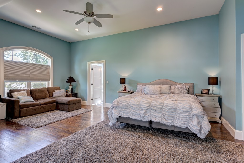 164 Beach Street Sharon, MA 02067 - Photo 22 of 30 a bedroom with a bed couch and window