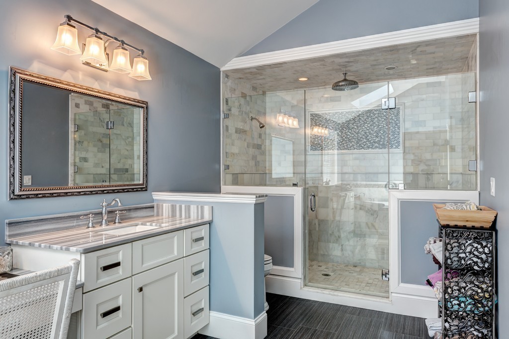 164 Beach Street Sharon, MA 02067 - Photo 23 of 30 a bathroom with a shower sink and mirror