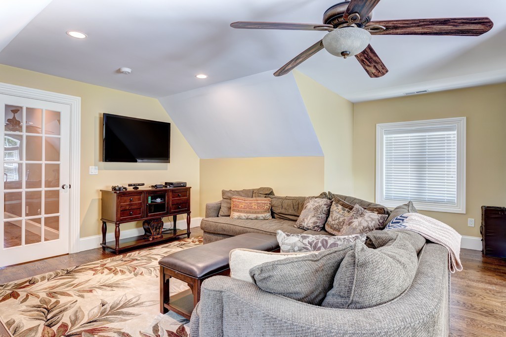 164 Beach Street Sharon, MA 02067 - Photo 25 of 30 a living room with furniture and a flat screen tv