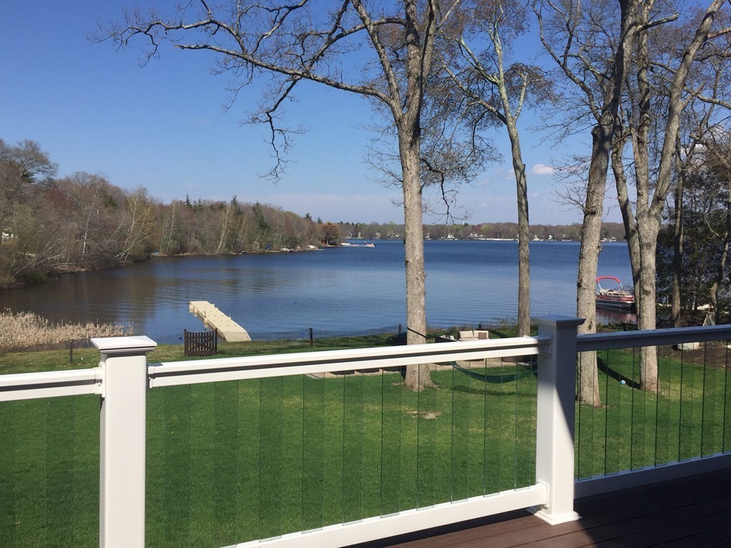 164 Beach Street Sharon, MA 02067 - Photo 28 of 30 a view of a lake with a yard from a terrace