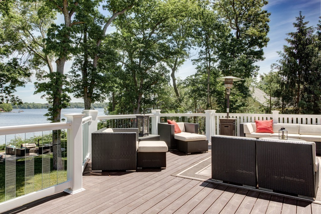 164 Beach Street Sharon, MA 02067 - Photo 29 of 30 a view of roof deck with chairs and wooden floor