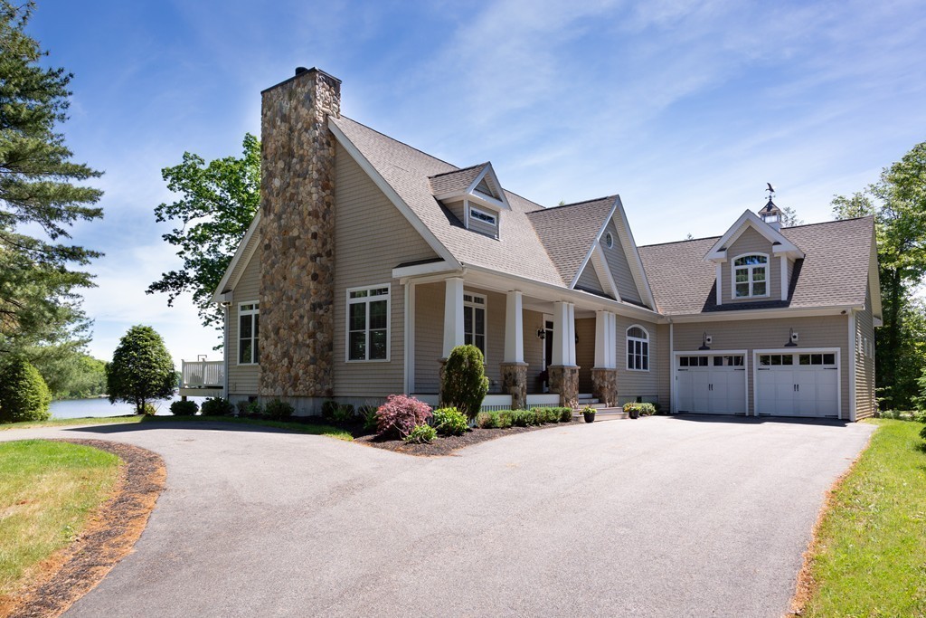 164 Beach Street Sharon, MA 02067 - Photo 4 of 30 a front view of a house with a yard