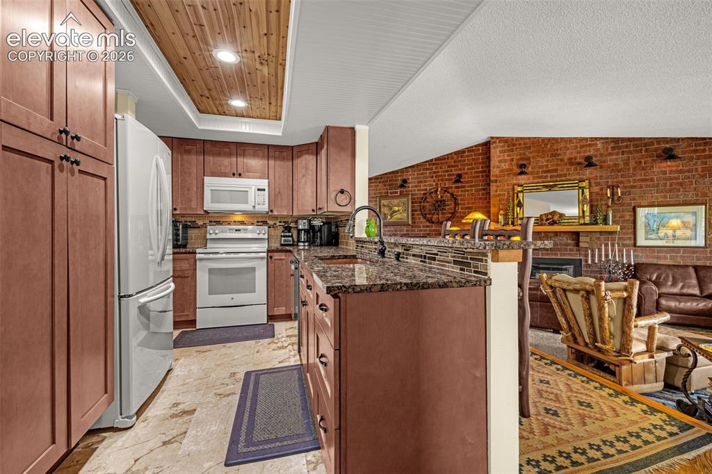 1658 Deer Creek Road Monument, CO 80132 - Photo 10 of 21 Large copper sink and granite counters