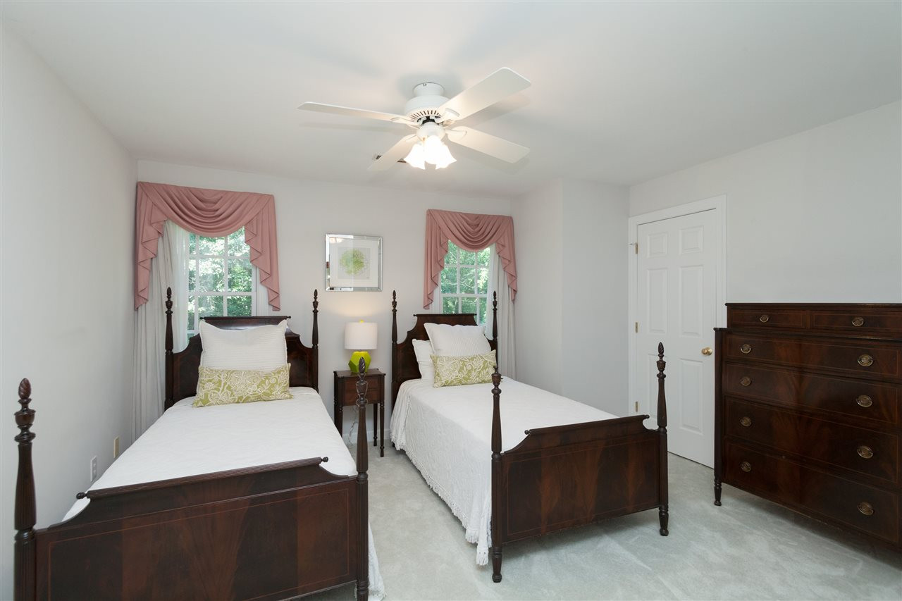4124 Ridgebrook Bluffs Drive Raleigh, NC 27603 - Photo 17 of 24 Large closet, ceiling fan, neutral paint and carpet. Bedroom
