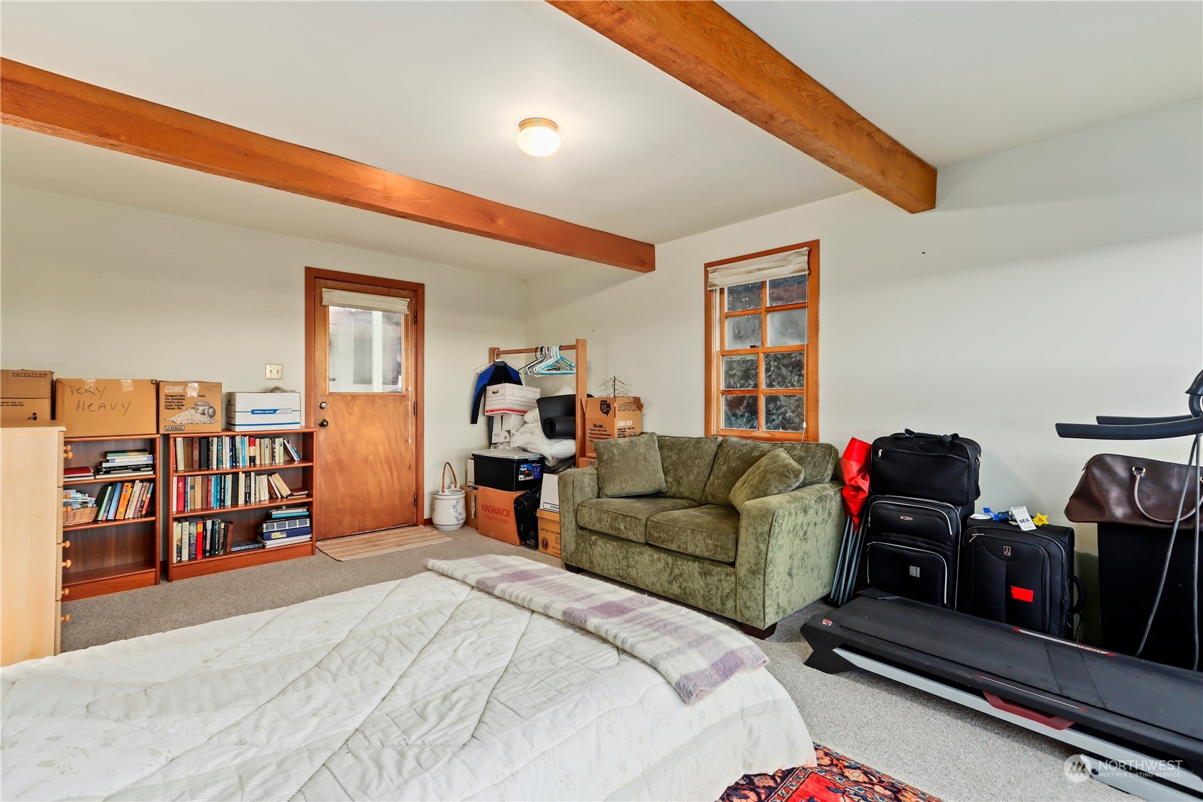 15916 Kamb Road Mount Vernon, WA 98273 - Photo 27 of 29 a living room with furniture a flat screen tv and dresser next to a window