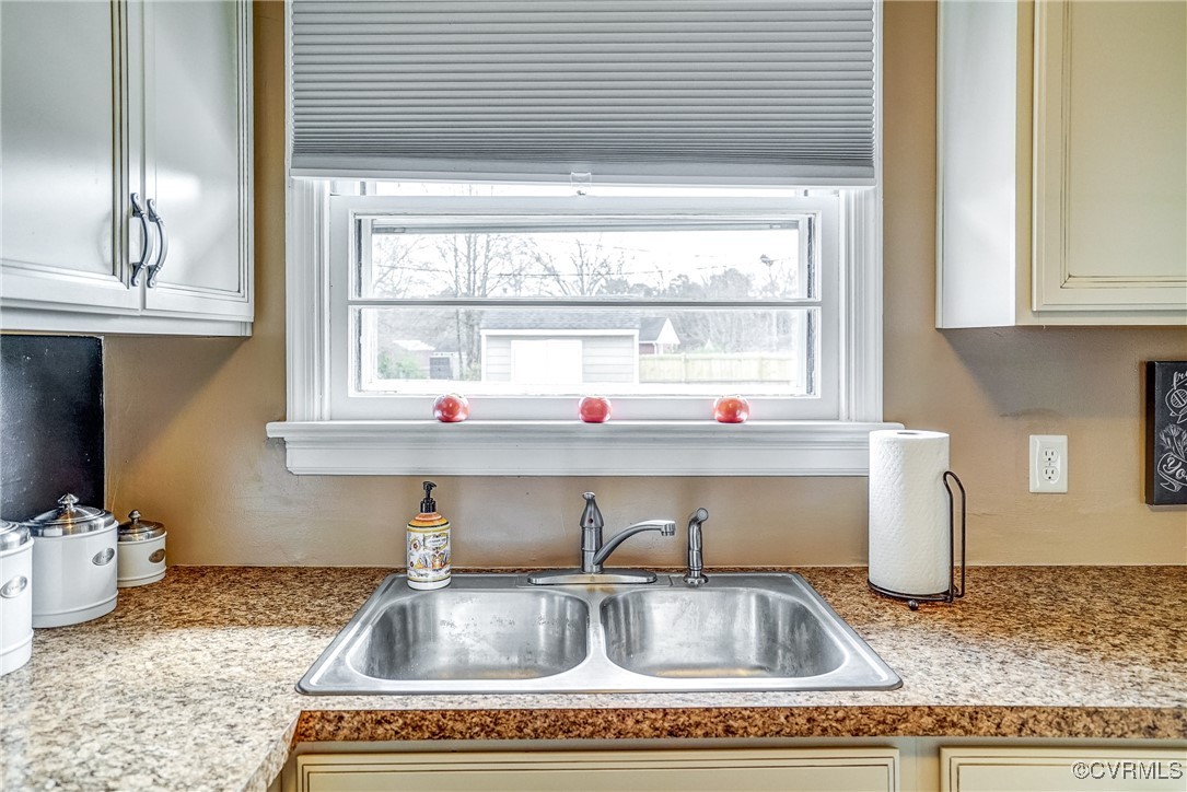 2703 Omega Road Henrico, VA 23228 - Photo 14 of 43 Kitchen featuring light countertops and double si