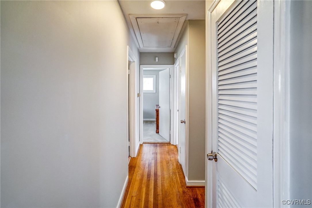 2703 Omega Road Henrico, VA 23228 - Photo 22 of 43 Hall with wood floors, attic access, two closets