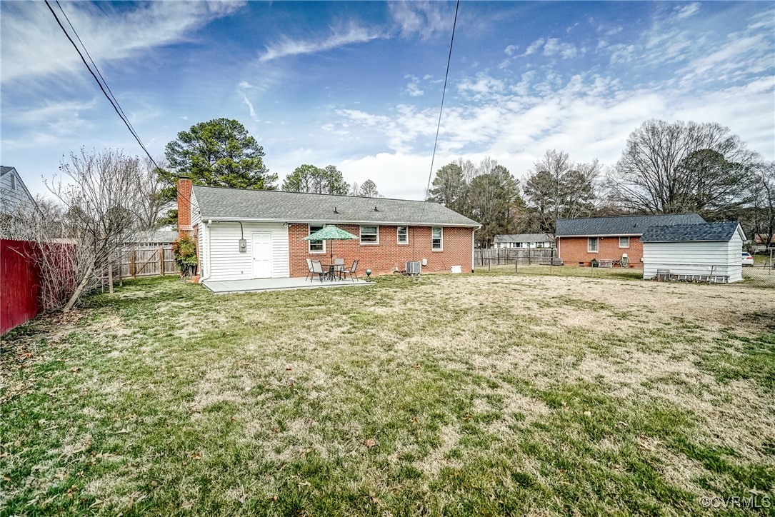 2703 Omega Road Henrico, VA 23228 - Photo 33 of 43 Rear view of house featuring a fenced backyard!