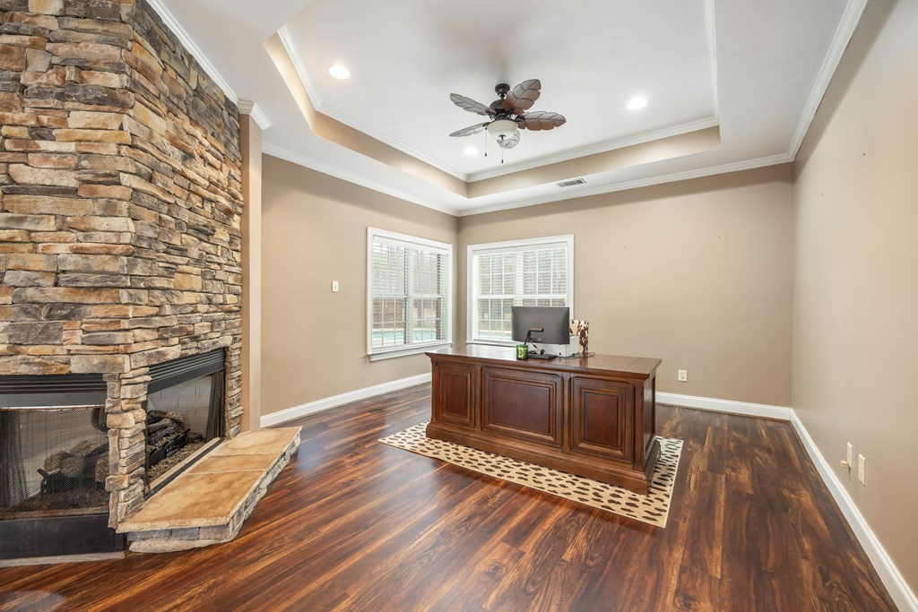 235 Voorhees Road Hamilton, GA 31811 - Photo 12 of 36 a living room with furniture and a fireplace