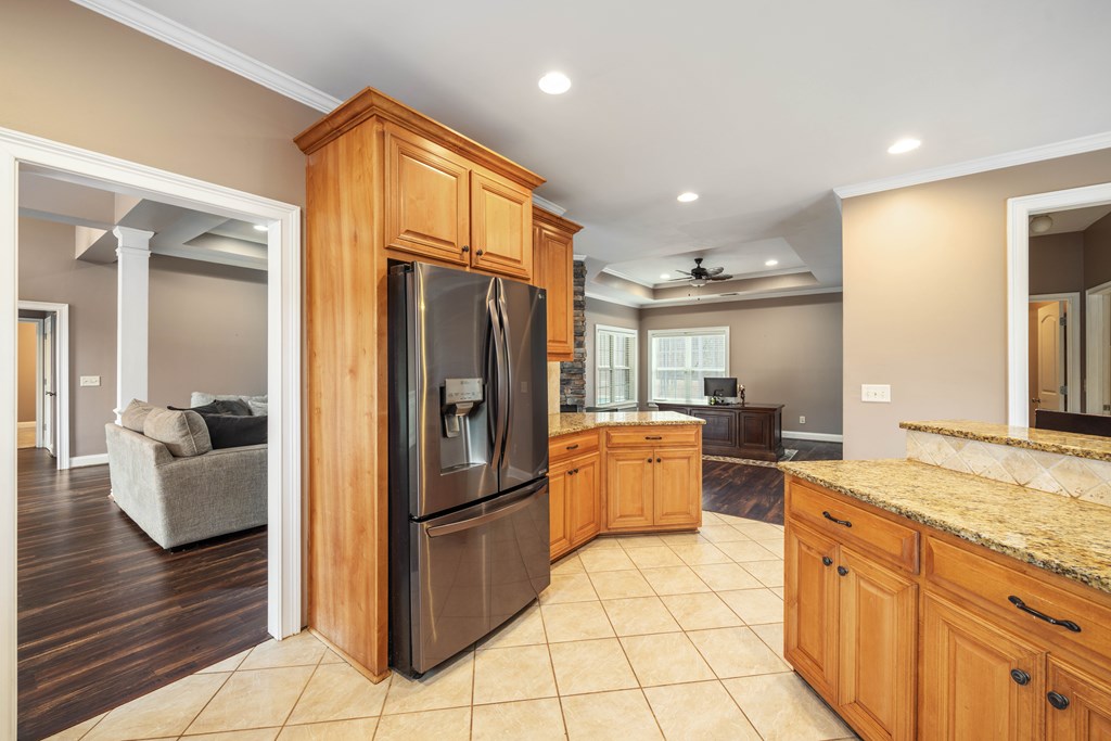 235 Voorhees Road Hamilton, GA 31811 - Photo 18 of 36 a kitchen with stainless steel appliances granite countertop a refrigerator and a sink