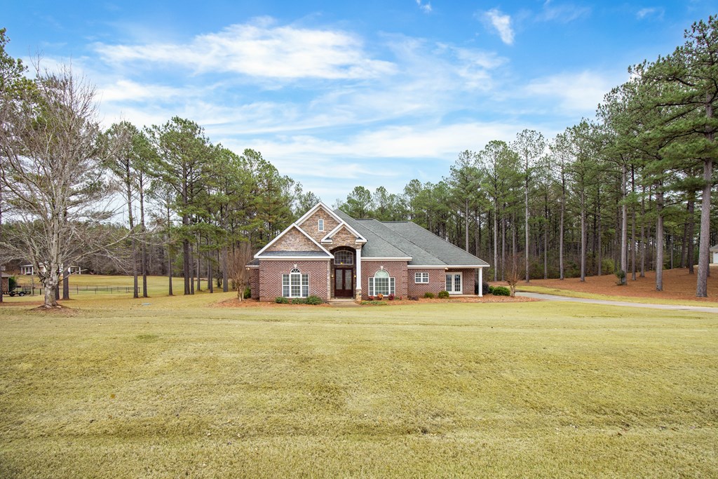 235 Voorhees Road Hamilton, GA 31811 - Photo 2 of 36 a view of a house with a outdoor space